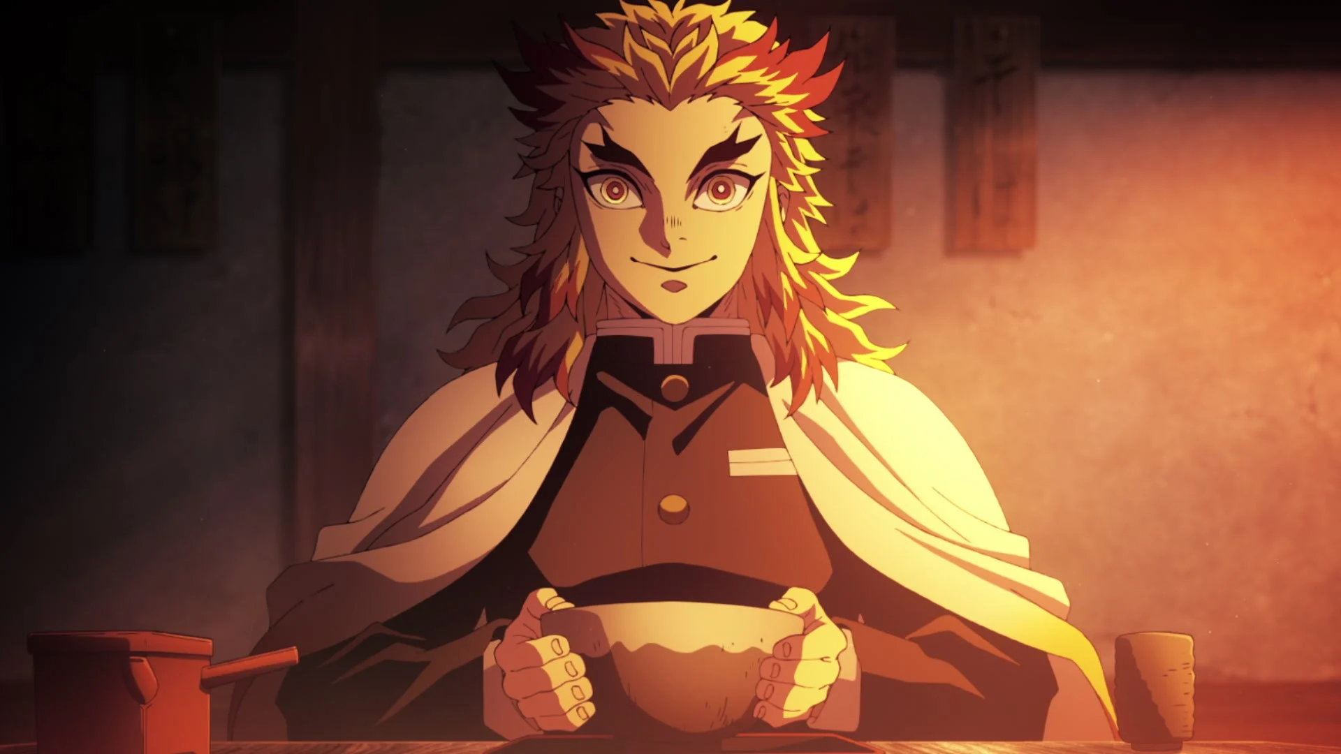 Kyojuro Rengoku, le Pilier de la Flamme, attablé devant un bol dans le premier épisode de l’arc du Train de l’infini