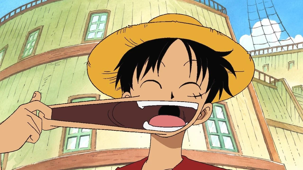 Luffy étire sa joue en riant dans le premier épisode de One Piece