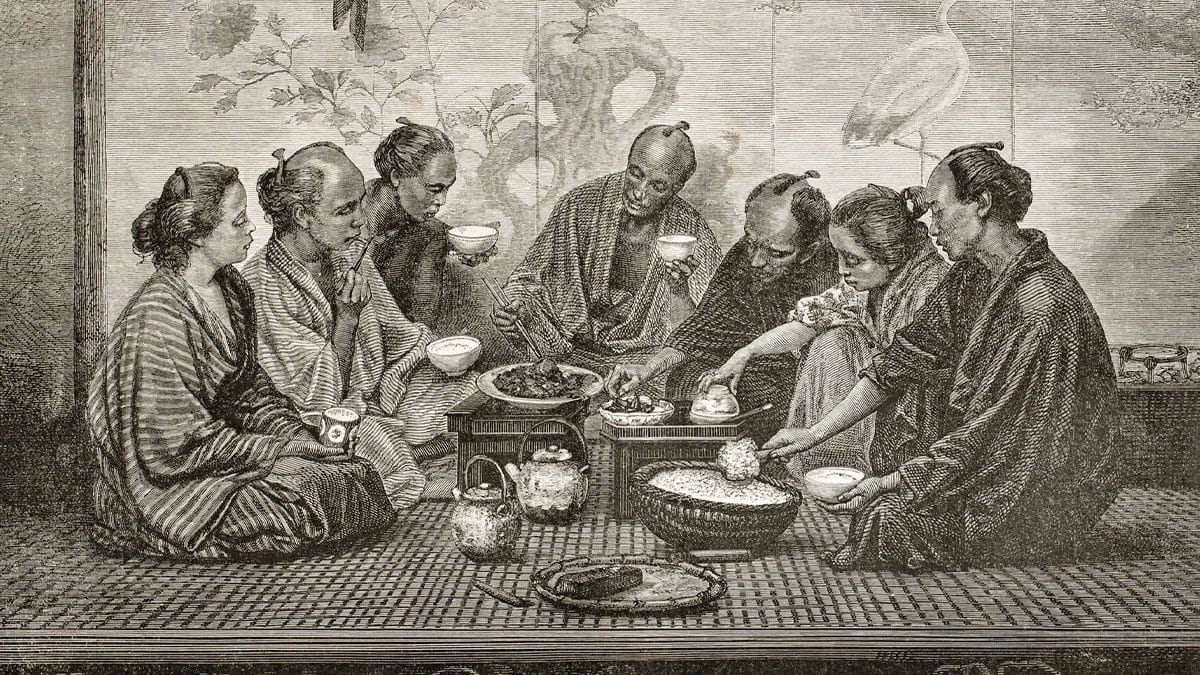 Gravure ancienne montrant des Japonais partageant un repas assis au sol
