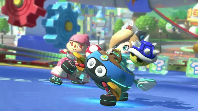 Harmony qui tient une carapace bleue dans sa main dans Mario Kart 8 Deluxe