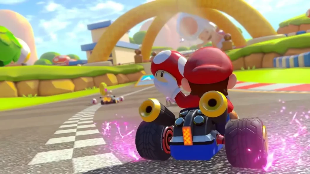Mario dans son kart avec un champignon de vitesse dans Mario Kart 8 Deluxe