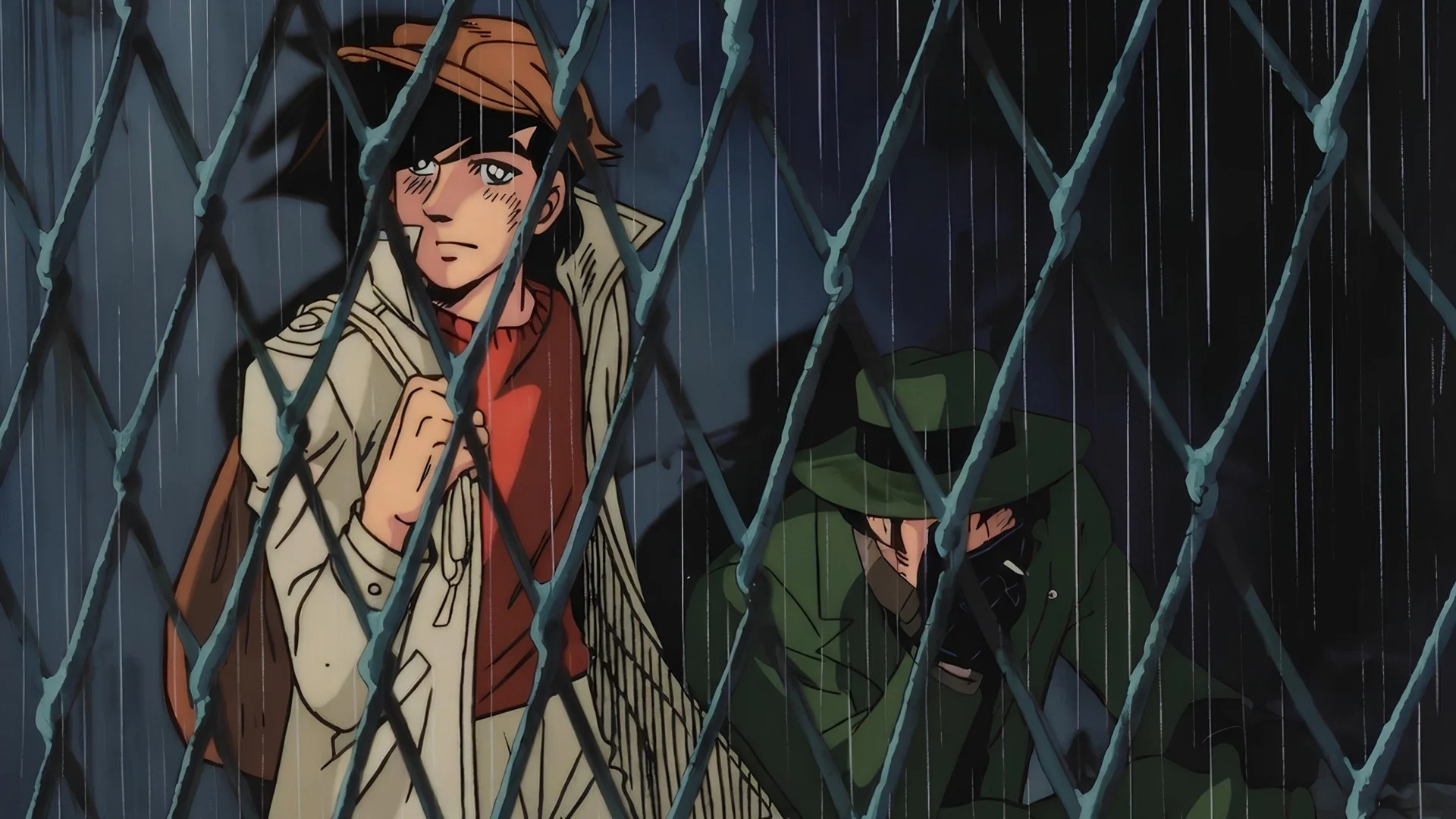 Joe Yabuki sous la pluie derrière un grillage dans l’anime Ashita no Joe (1970)