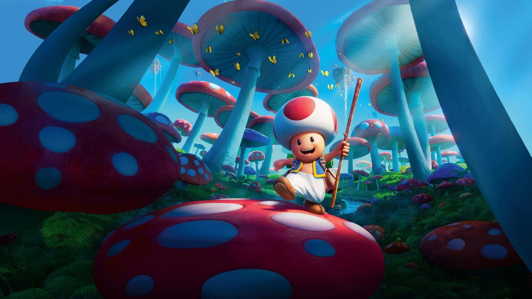 Toad marche sur un champignon géant au milieu d'une forêt de champignons bleus et rouges dans Super Mario Bros. le film
