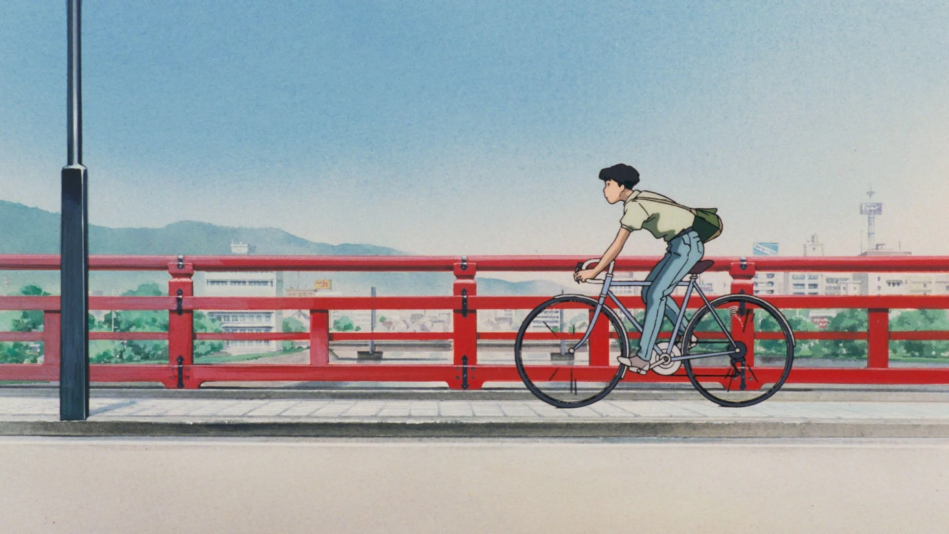 Un lycéen à vélo sur un pont rouge, dans Je peux entendre l’océan