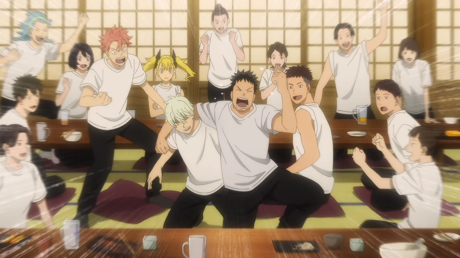 Kafka et les recrues de la 3e division font la fête autour d'une table dans l'anime Kaiju No.8